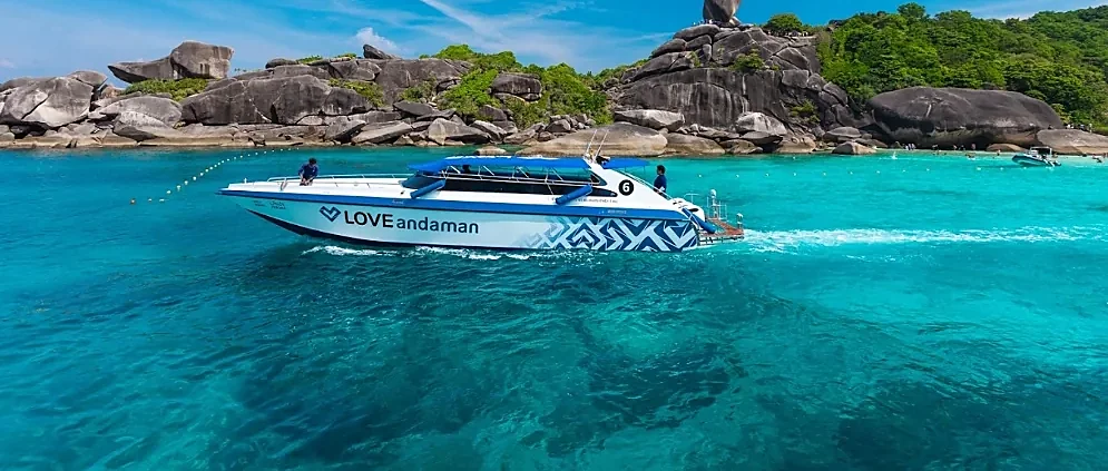 Crystal-clear turquoise waters surrounding Surin Island, accessible by tour from Thap Lamu Pier