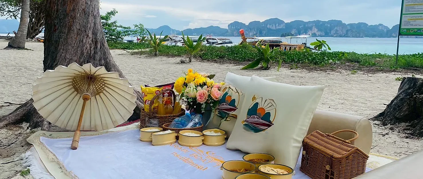 Private luxury longtail boat cruising past Krabi's islands at sunset