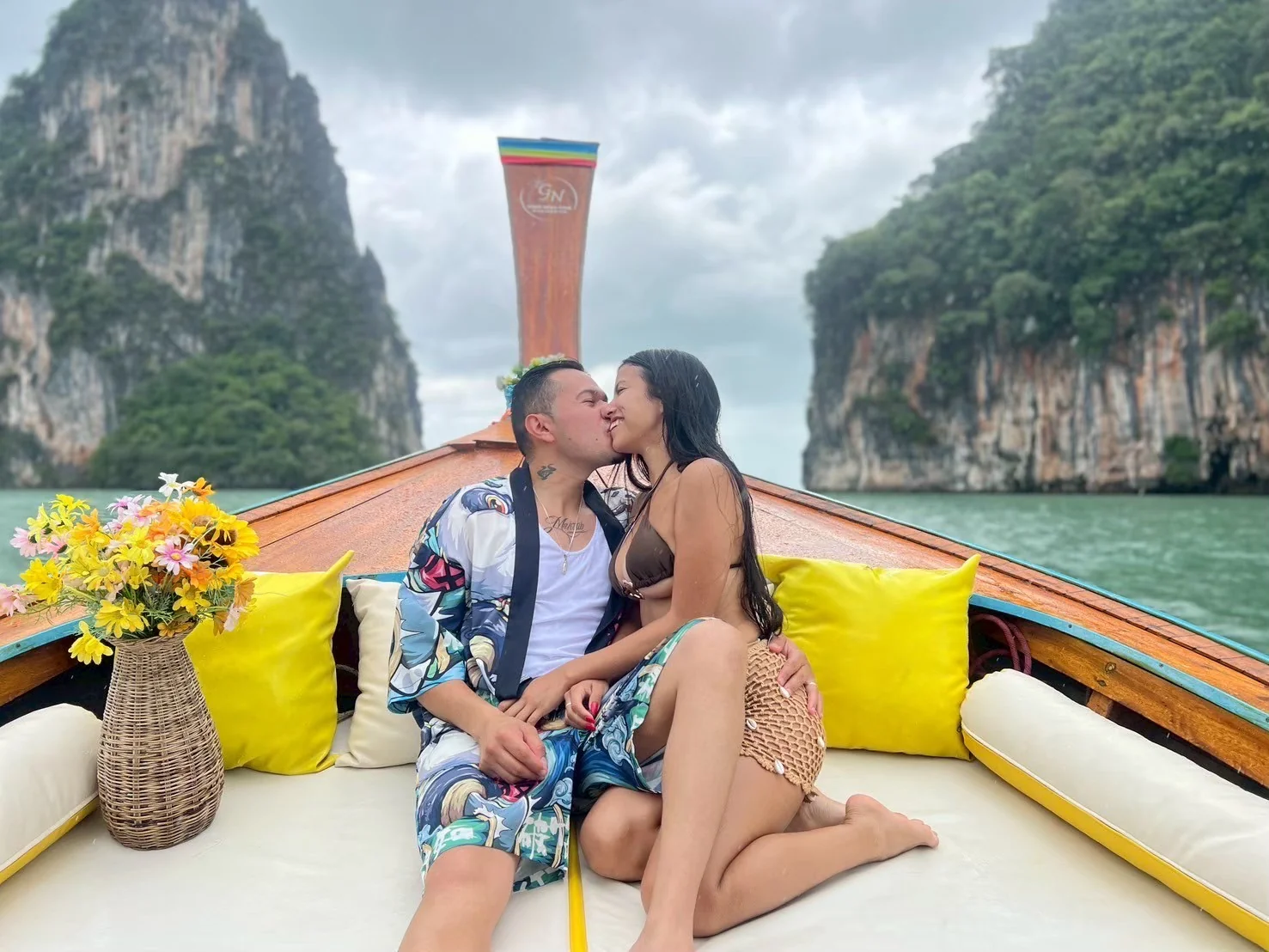 Luxury longtail boat cruising past limestone cliffs at James Bond Island