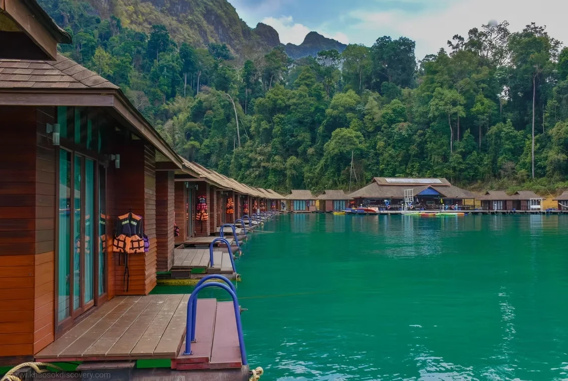 Laguna Cheow Lan Raft House floating amid limestone cliffs and emerald water in Khao Sok