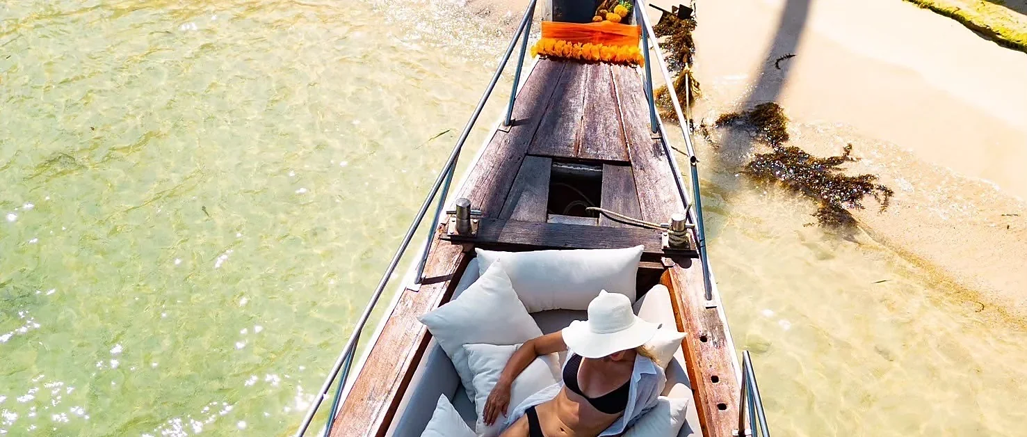 Luxury private longtail boat cruising off Samui Island on a Koh Tan and Koh Mudsum tour