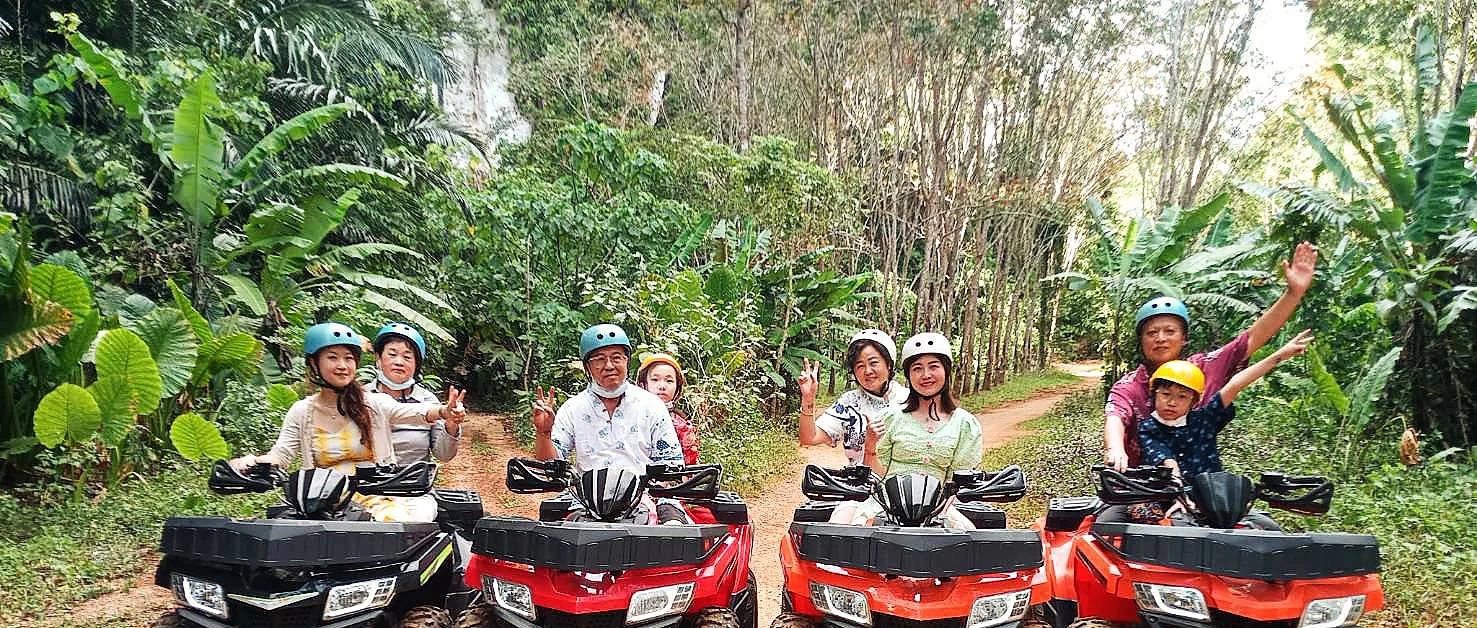 ATV rider blazing through jungle trails in Krabi, followed by a scenic elephant trek through lush forest