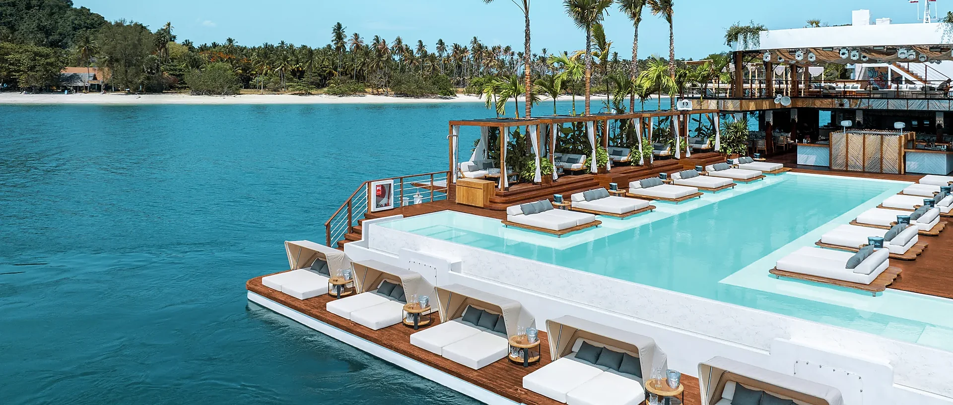 YONA Beach Club Phuket sunbeds overlooking the turquoise sea on a sunny afternoon