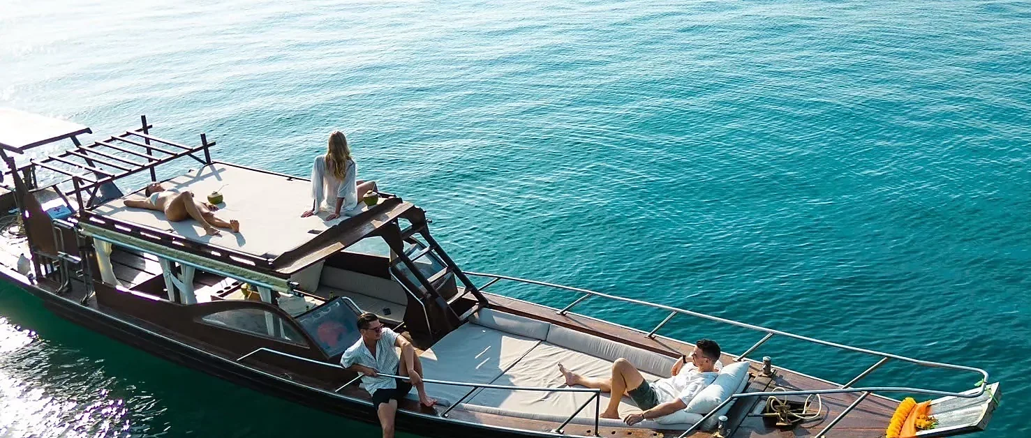 Luxury longtail boat cruising near Koh Tan and Koh Mudsum off Samui Island