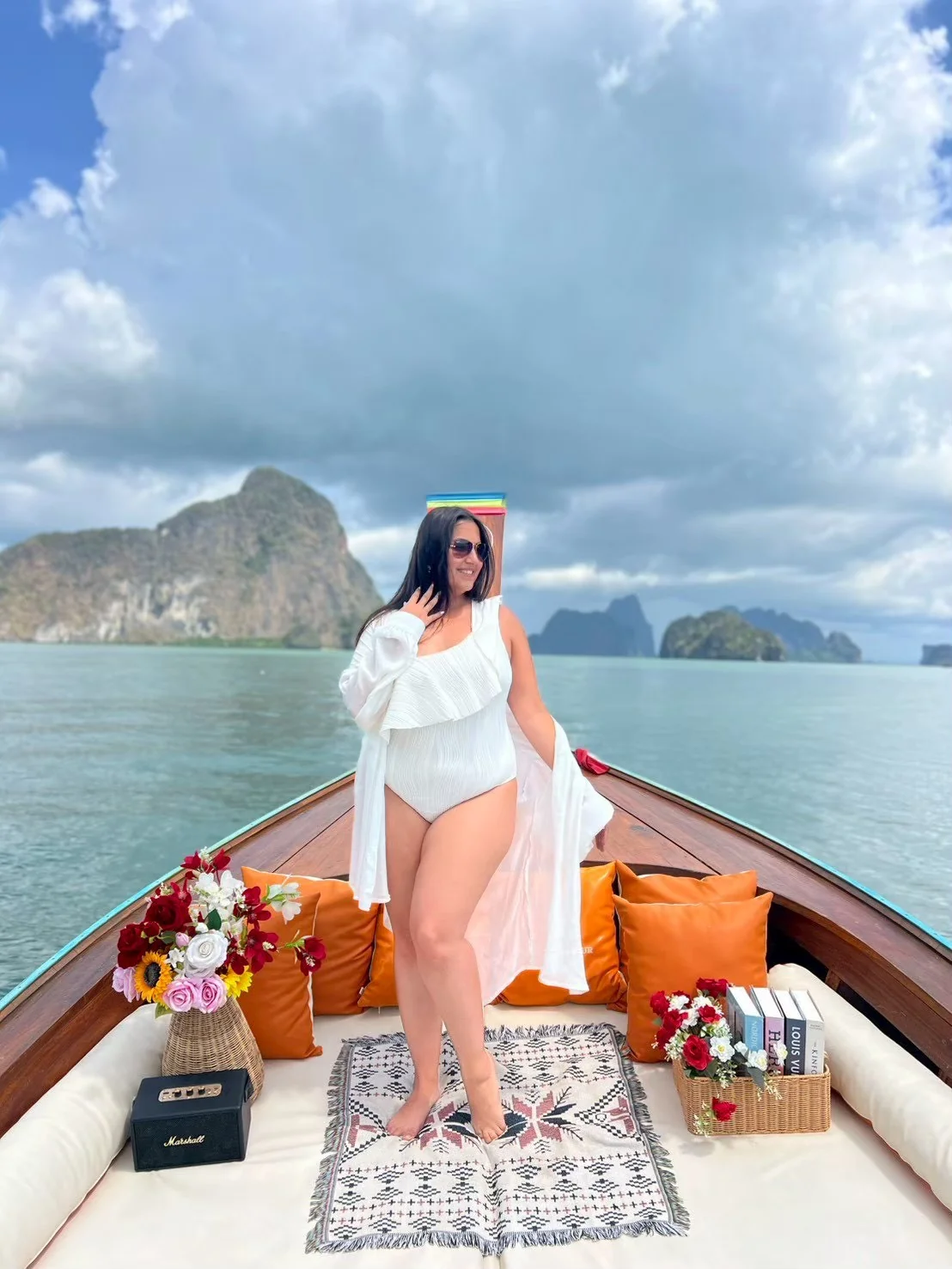 Luxury private longtail boat cruising past limestone cliffs at James Bond Island