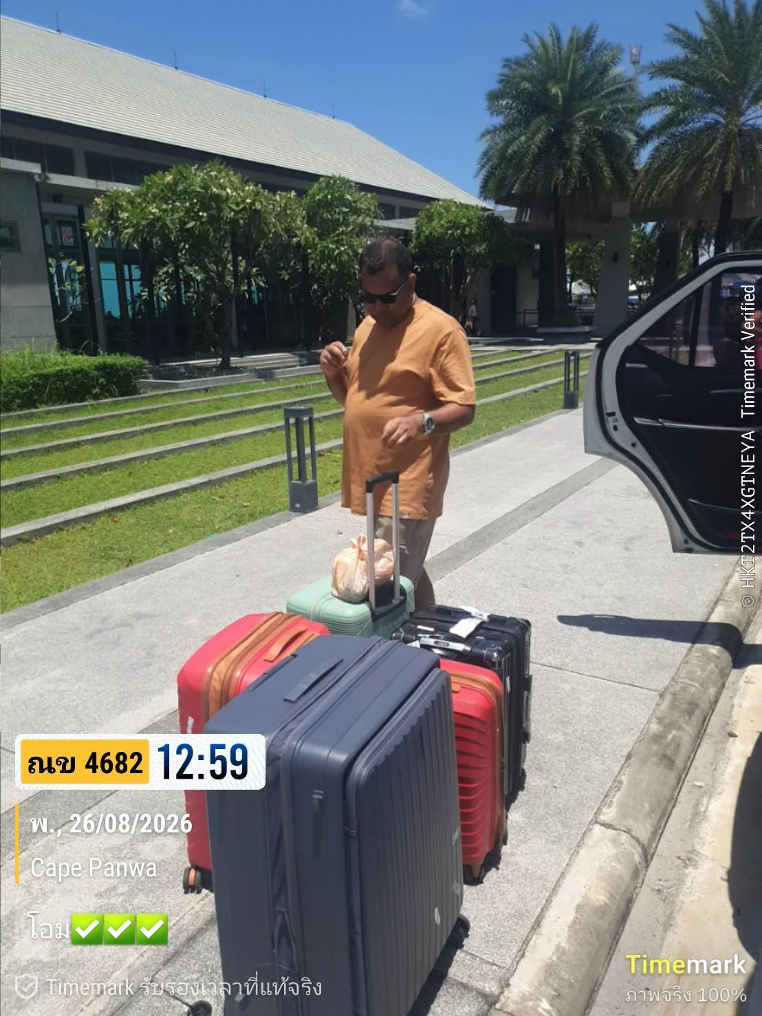 Guest with several suitcases beside a transfer vehicle at Cape Panwa, Phuket