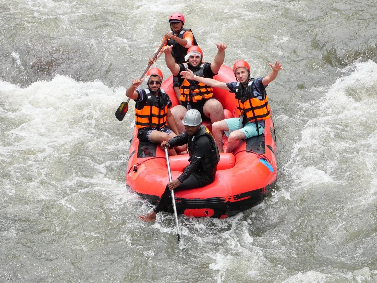 White water rafters navigating rapids on a 9 km adventure in Phang Nga