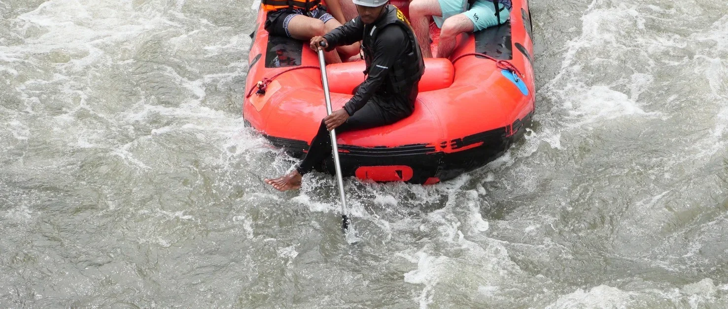 White water rafters navigating rapids on a 9 km adventure in Phang Nga