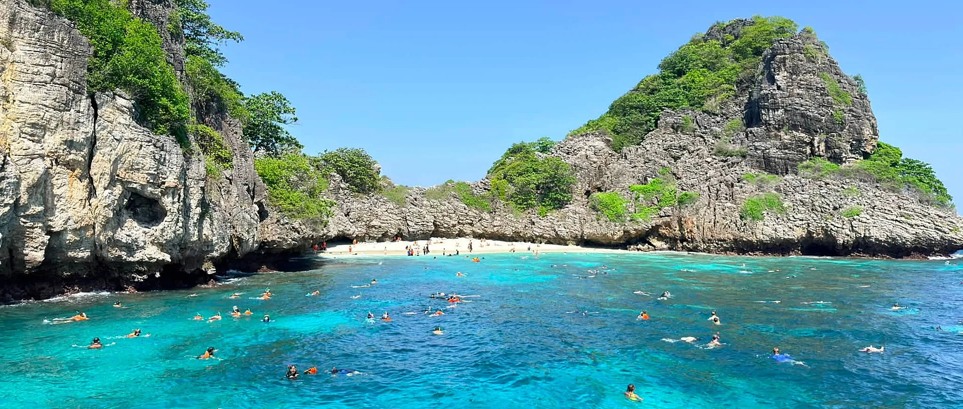 Turquoise waters and white-sand shores on a Koh Rok and Koh Ha speedboat tour from Koh Lanta Island