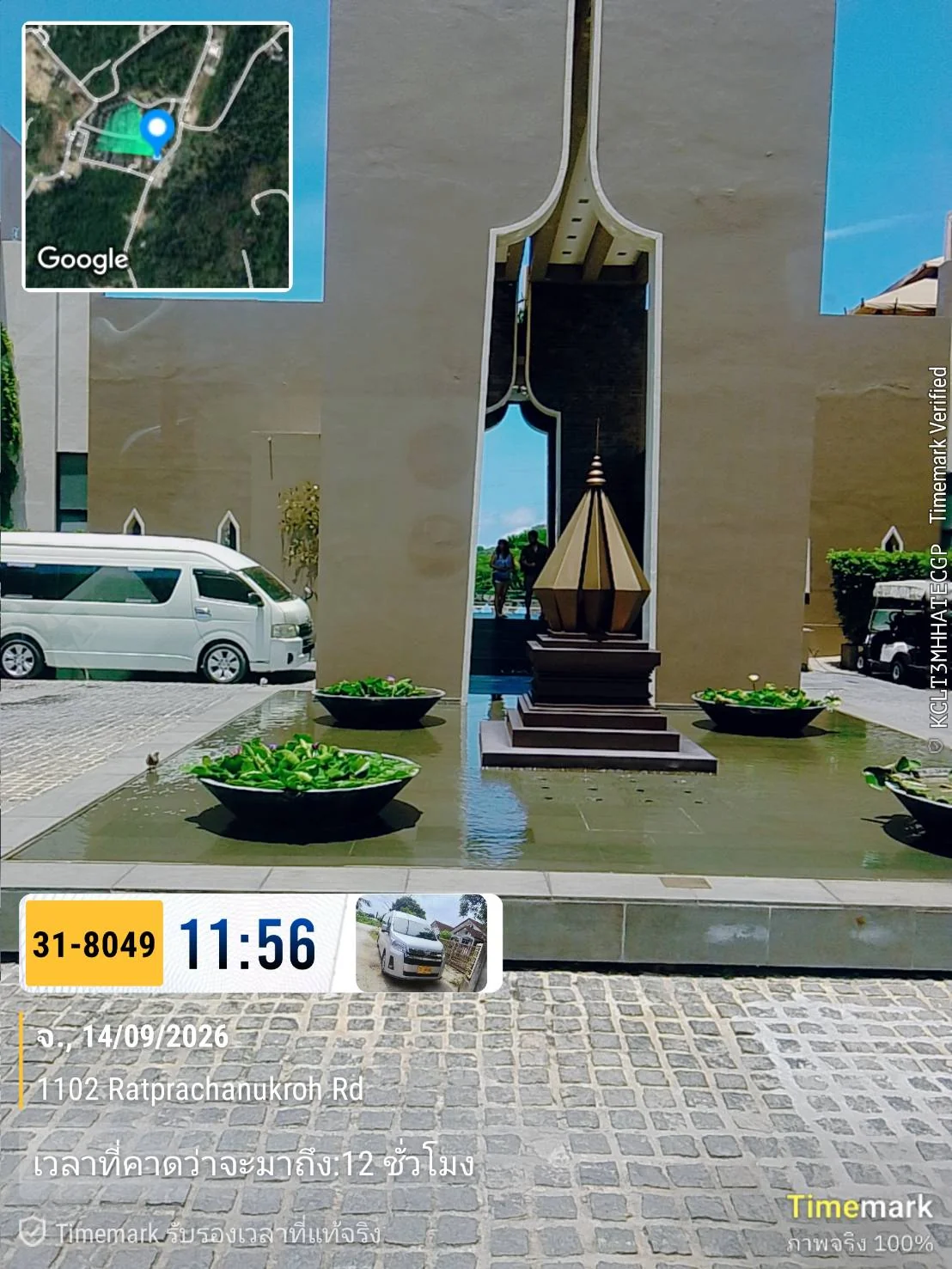 White passenger van waiting at a hotel entrance on Ratprachanukroh Road in Patong, Phuket