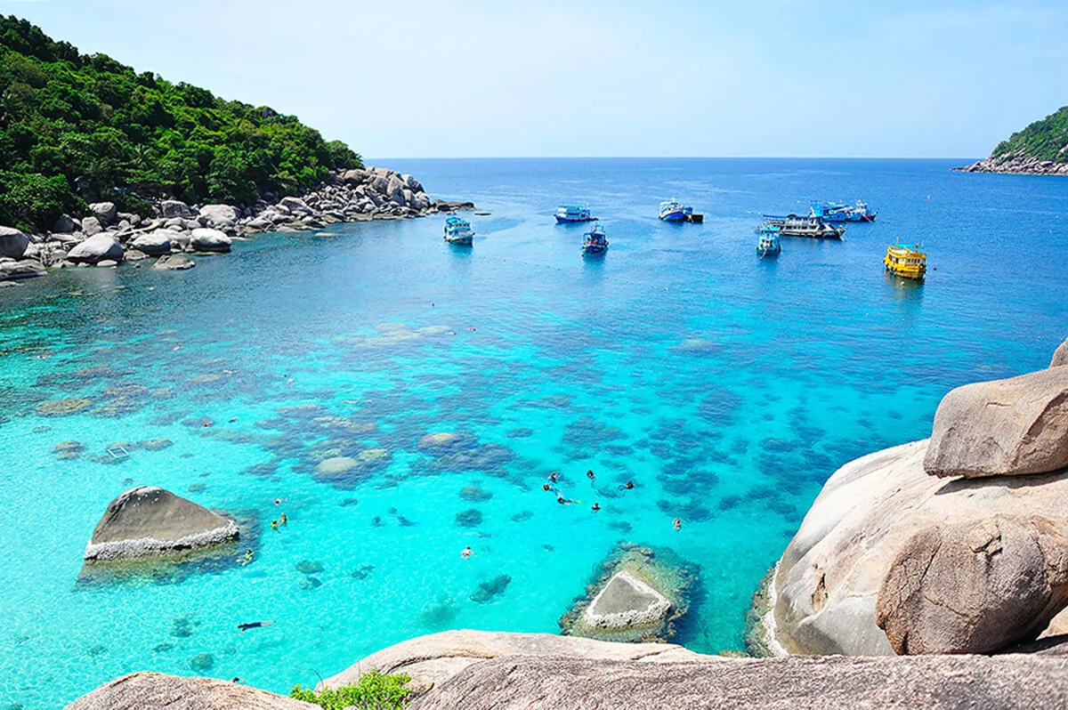 Speedboat cruising past limestone islands in Ang Thong National Marine Park, southern Thailand