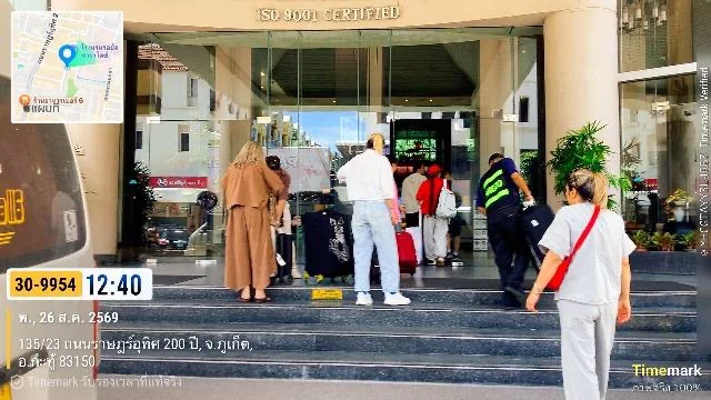 Cyber Tour Phuket staff assisting guests with luggage at a Phuket hotel entrance