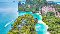 Turquoise waters and towering limestone karsts surround Hong Island on a speed boat tour from Krabi