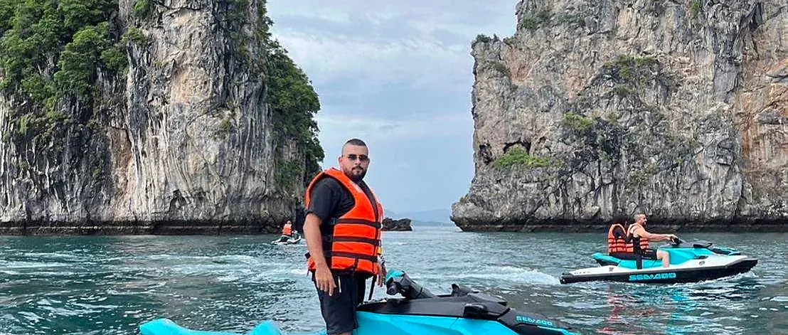 Riders speeding across turquoise water on a Sea-Doo jet ski during a six-island tour in Phuket