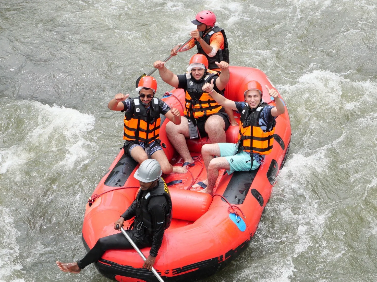 White water rafting through lush jungle rapids on an adventure tour in Phang Nga