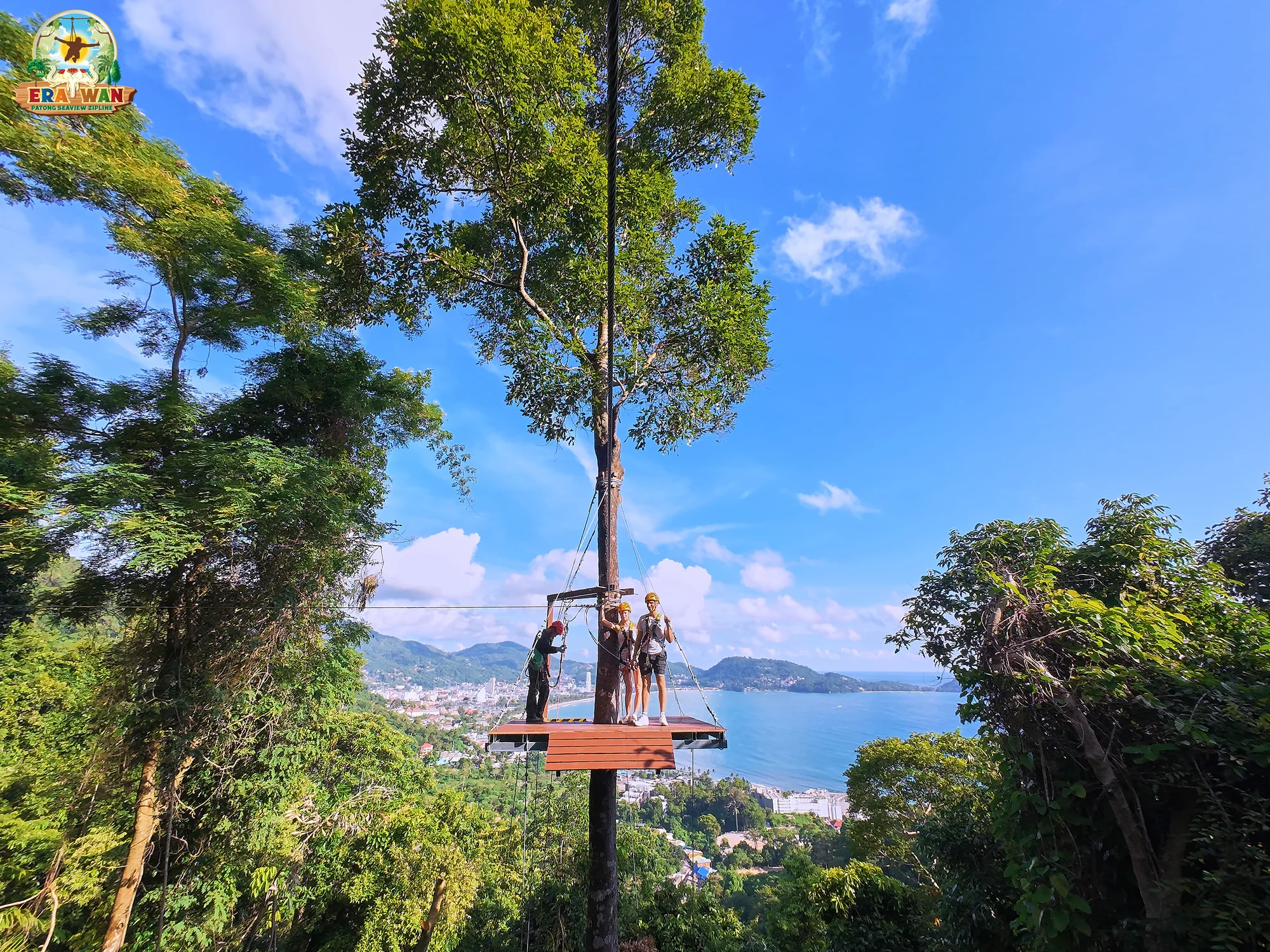 Aerial zipline ride above Patong's lush jungle canopy with panoramic sea views stretching to the horizon