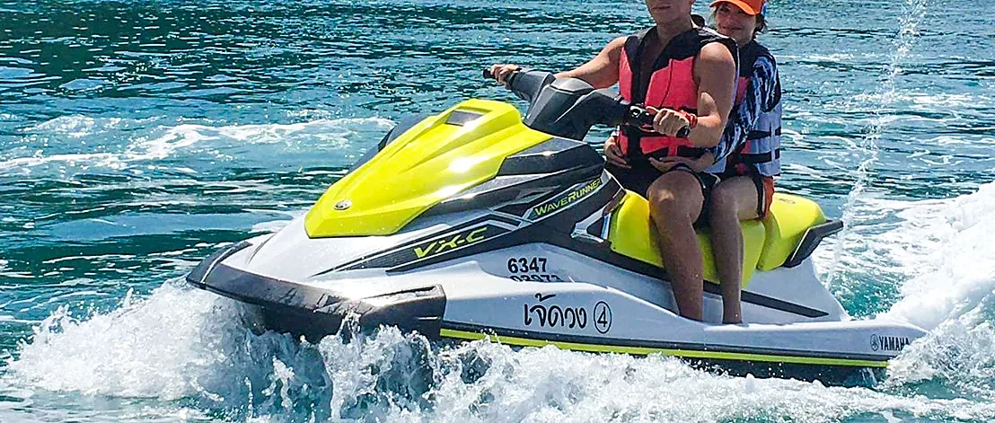 Jet ski riders speeding across turquoise waters on a five-hour safari around Samui Island
