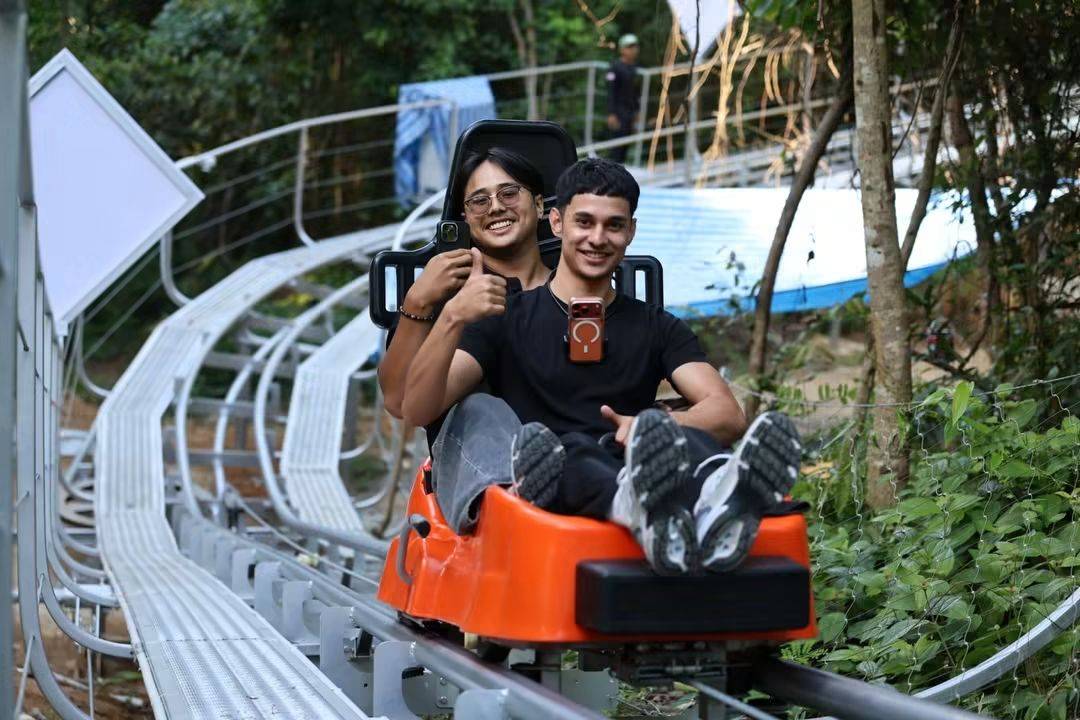 Riders enjoying two laps on a 900-metre roller coaster track in Phuket