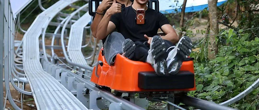 Riders enjoying two laps on a 900-metre roller coaster track in Phuket