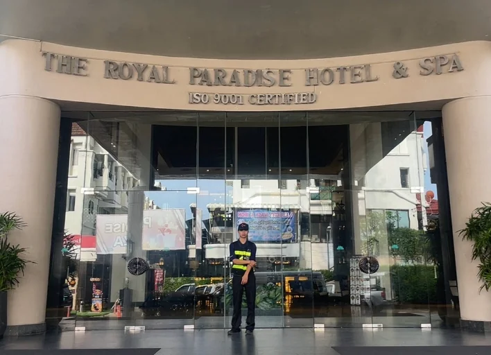 Cyber Tour Phuket staff standing at the entrance of Royal Paradise Hotel & Spa in Patong