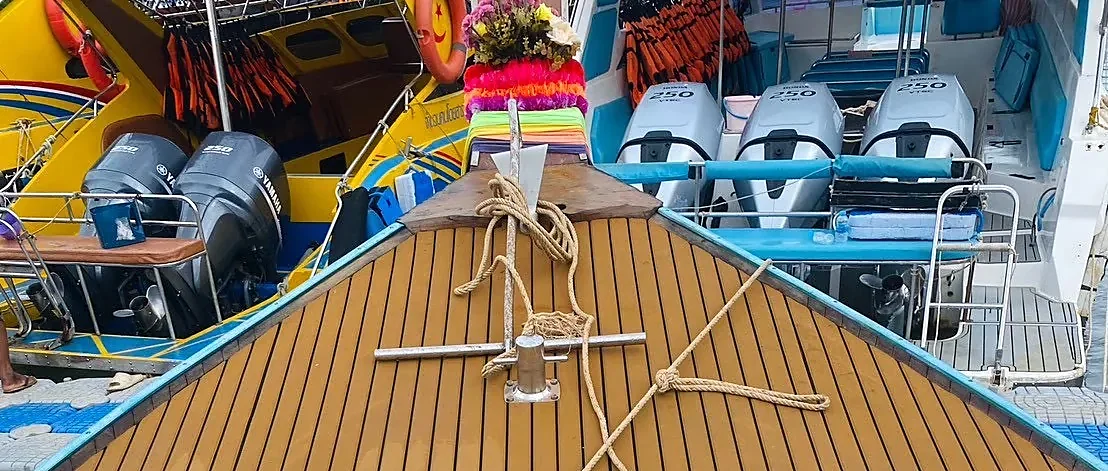 Private luxury longtail boat cruising Krabi's Four Islands on a guided tour