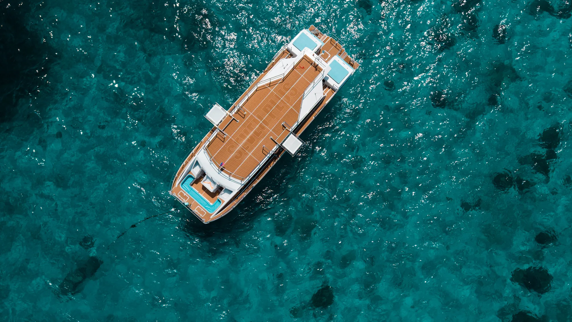 Dream Voyager comfort cruise anchored near dramatic granite boulders at Similan Islands National Park