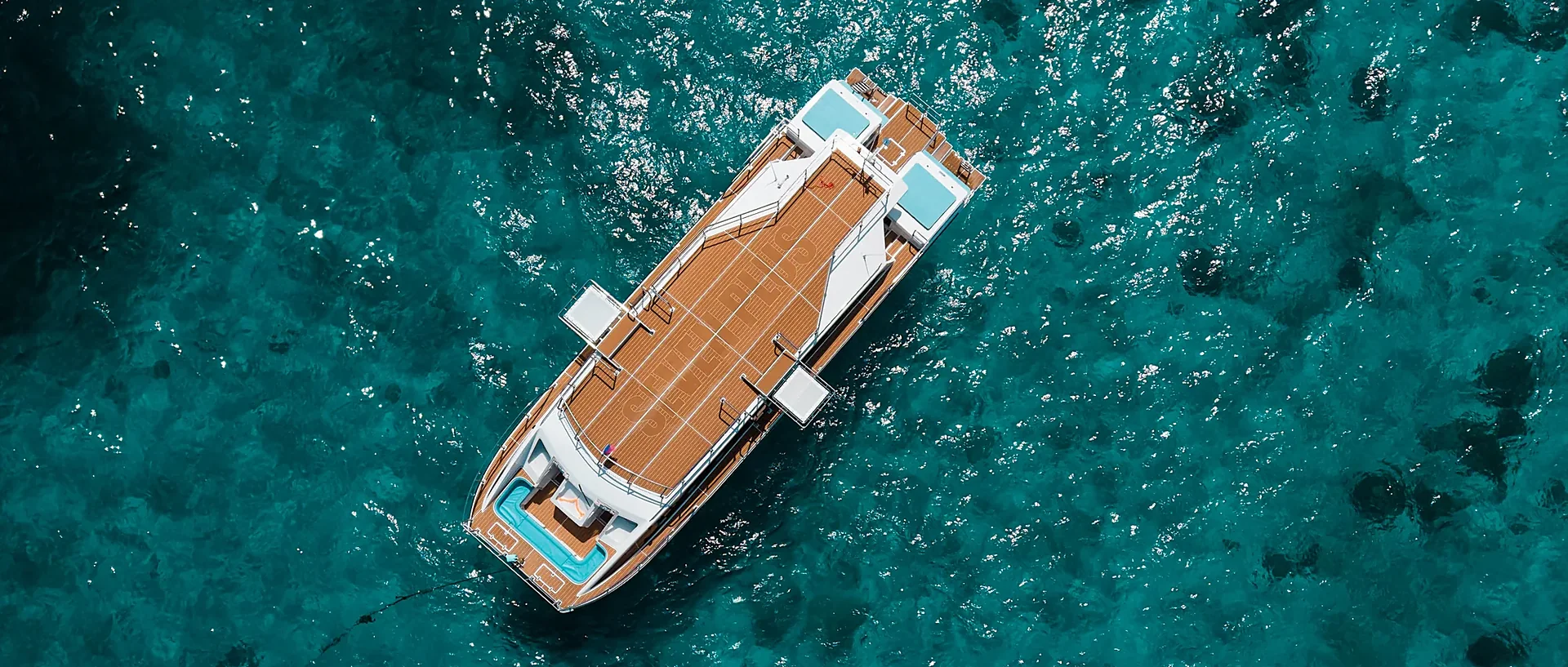 Dream Voyager comfort cruise anchored near dramatic granite boulders at Similan Islands National Park