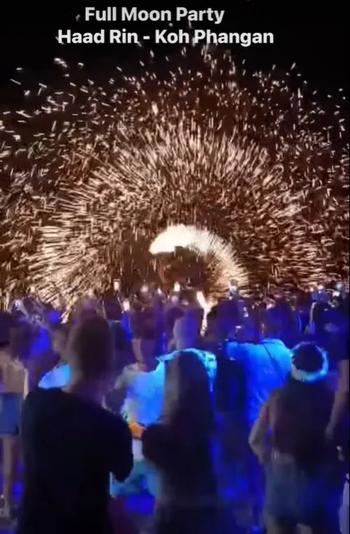 Full Moon Party revelers dancing on Koh Phangan during a night tour from Samui Island