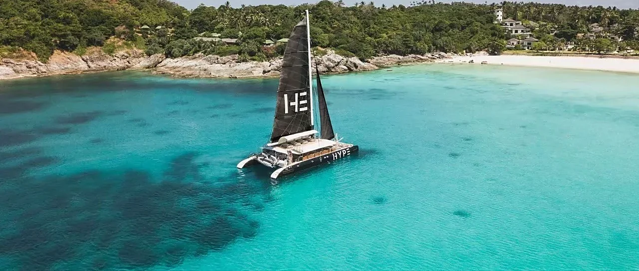 NOAH Catamaran sailing turquoise waters near Coral and Racha Island on a bright sunny day
