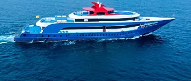 Ferry boat crossing turquoise waters from Phuket Rassada Pier to Phi Phi Island on a sunny morning