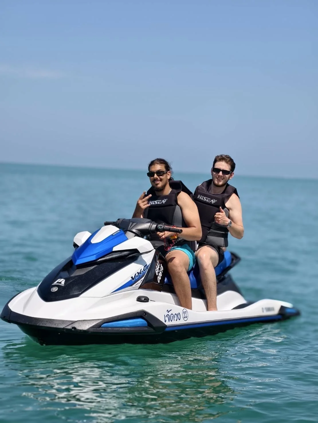 Jet ski riders cruising toward Koh Mudsum on a morning safari from Samui Island