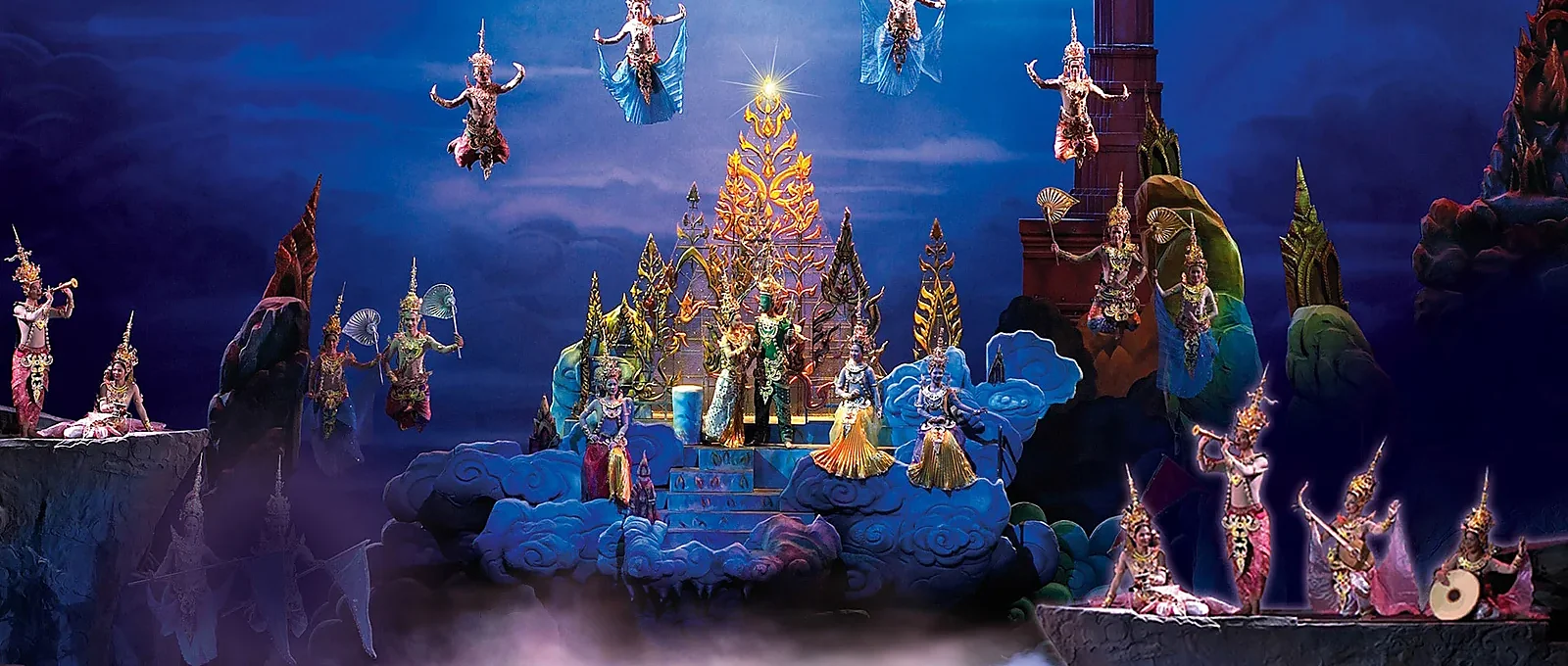Siam Niramit cultural show performers in elaborate costumes on a grand stage in Phuket